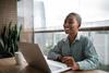 smiling-woman-working-from-home-1313460653